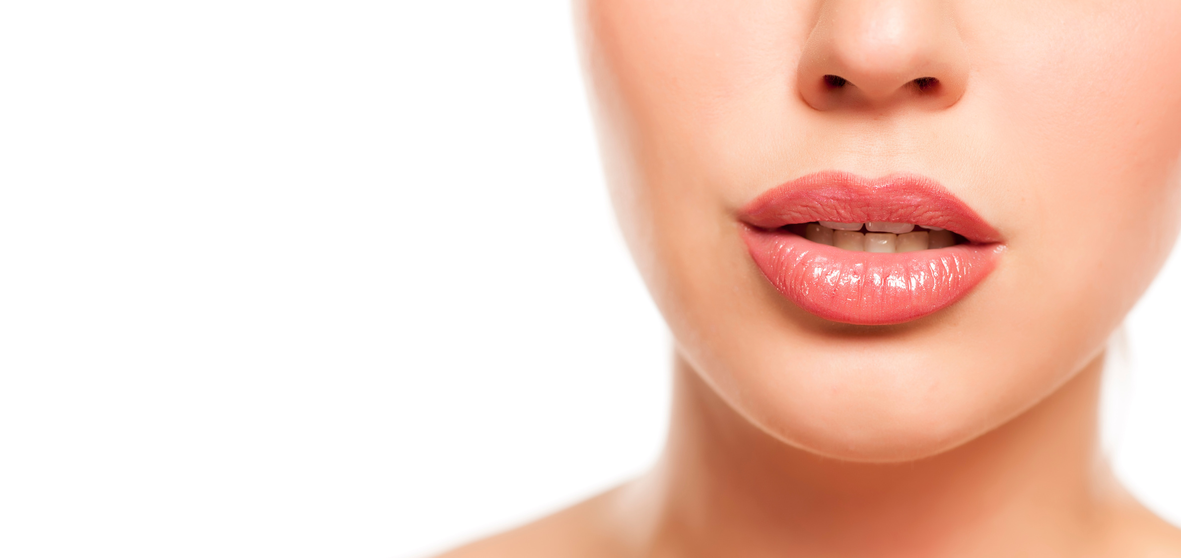 beautiful female lips with lip gloss on white background